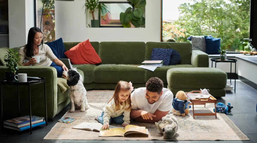 Family of three spending time together in the living room.