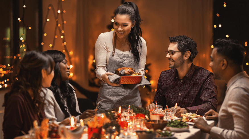 Friends having Thanksgiving dinner together.